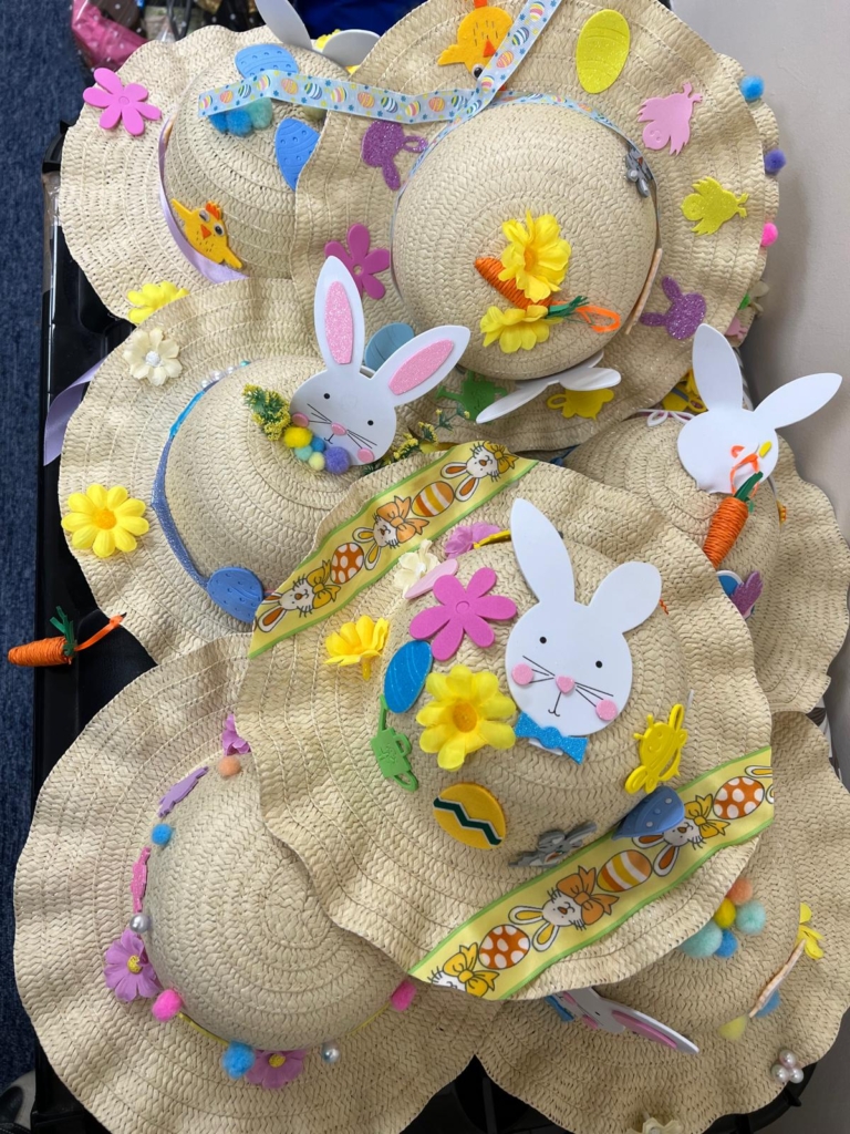A a piles of entries to the Easter bonnet competition. 